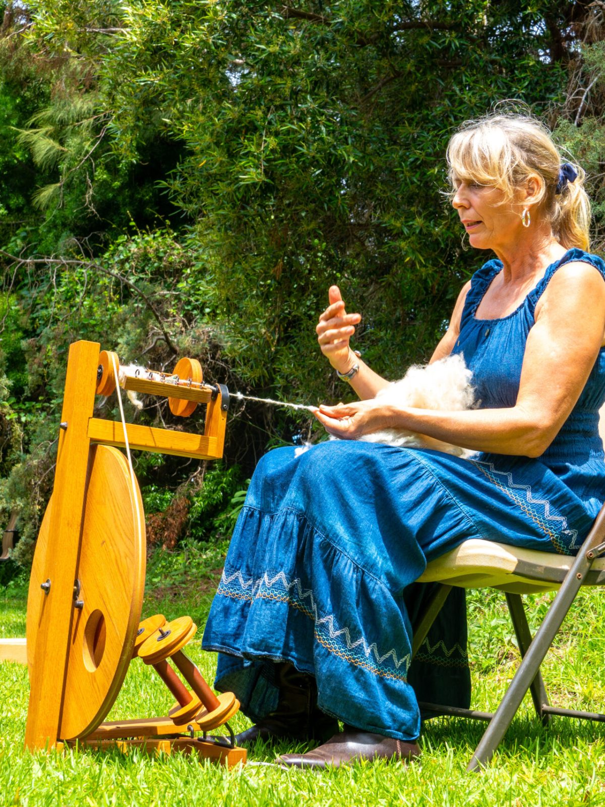 a young boy sitting on a bench in a park