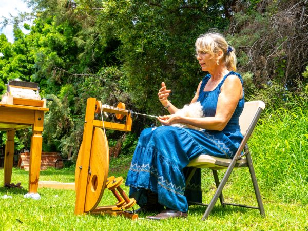 a young boy sitting on a bench in a park