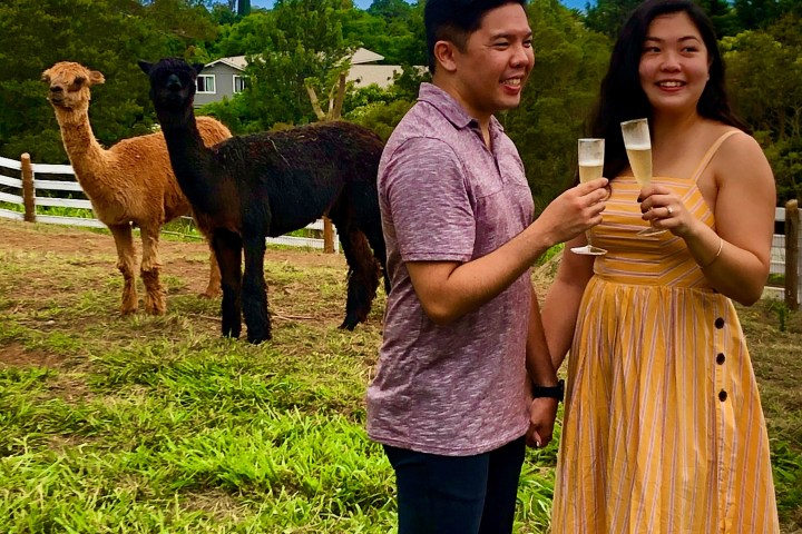 a person standing in front of a group of people posing for the camera
